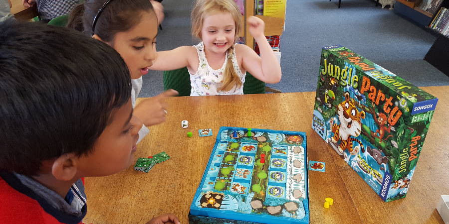 Children playing a board game.