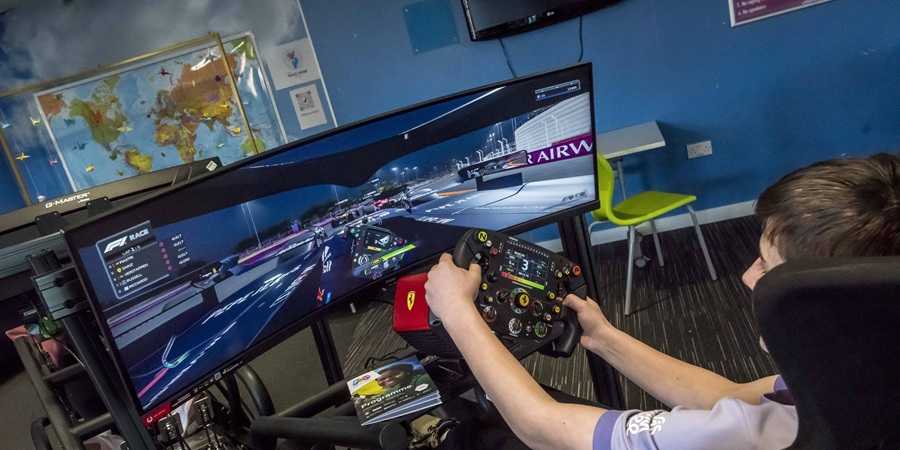 Young person playing racing video game.