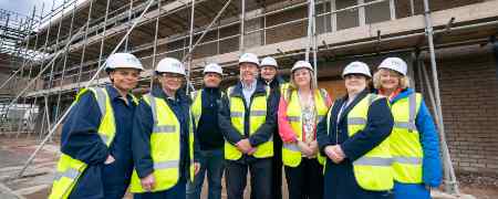 Councillors and stakeholders outside development.