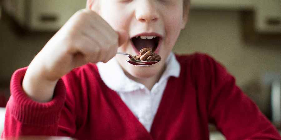 Child eating breakfast cereal.