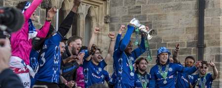 Rochdale players with the trophy.