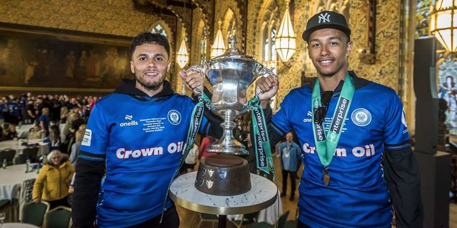 Rochdale AFC players with the trophy in the town hall.