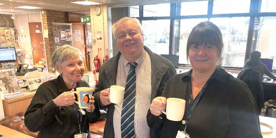 Councillor Neil Emmott with council staff.