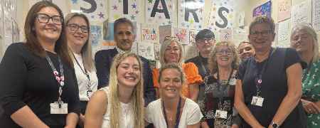 Councillor Shah Wazir with STARS team members.