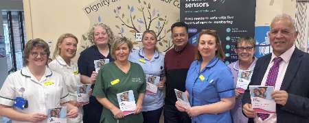 Councillors Daalat Ali and Iftikhar Ahmed with Tudor Court staff.
