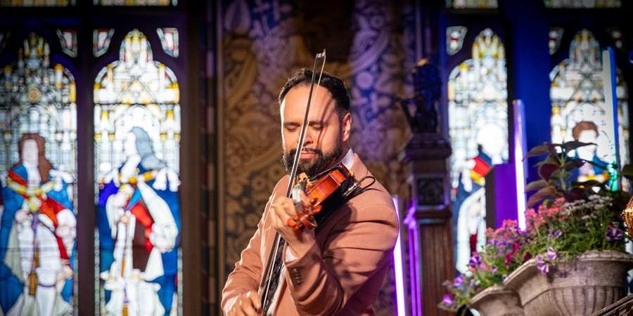 Faz Shah playing violin.