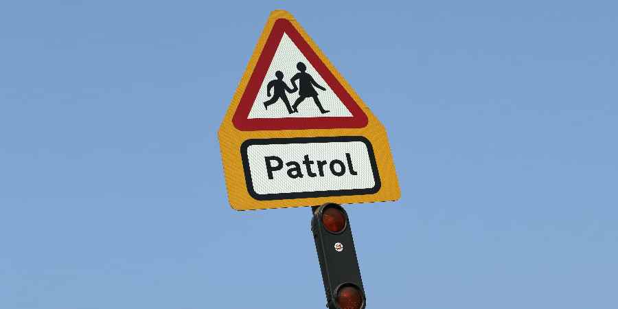 School crossing patrol sign.