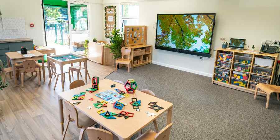 A classroom with desks and toys.