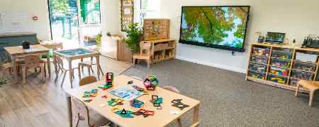 Classroom with desks and toys.