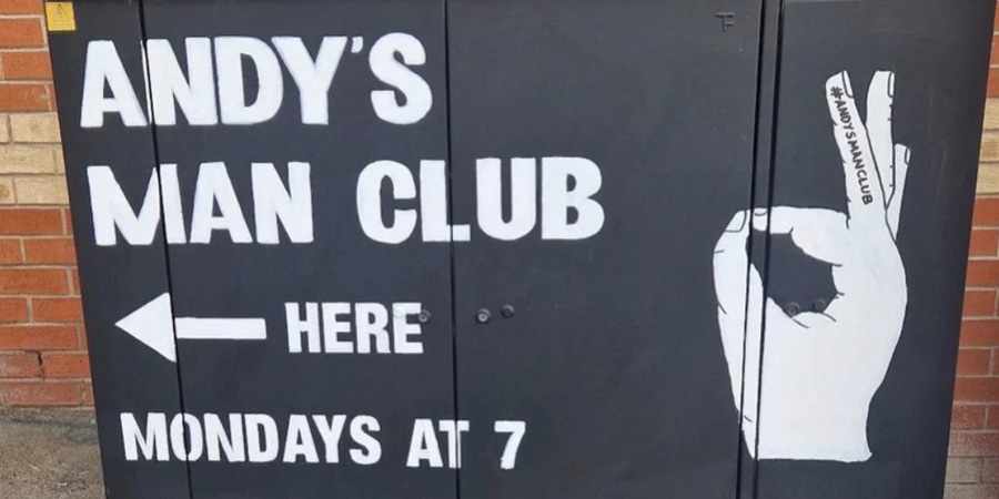 Sign pointing to Andy's Man Club.