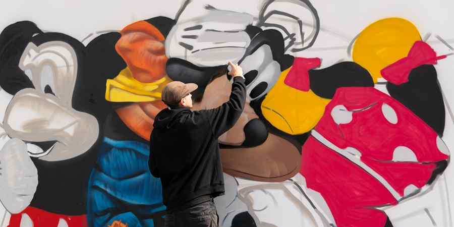 Artist painting mural.