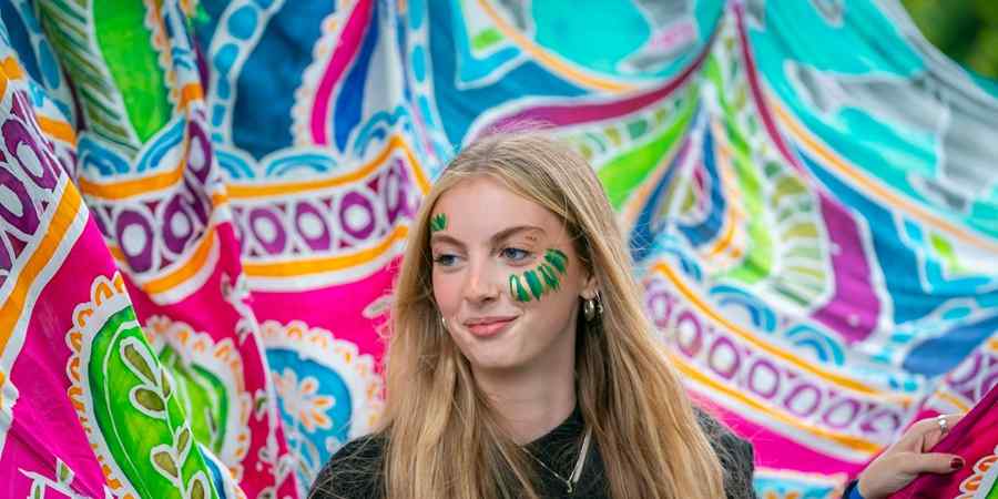 Young person with face paint.