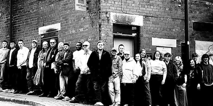 Artists stood outside Voltalab Sound Studios.