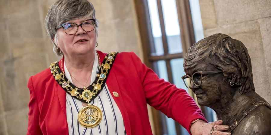 Councillor Janet Emsley beside the bust.