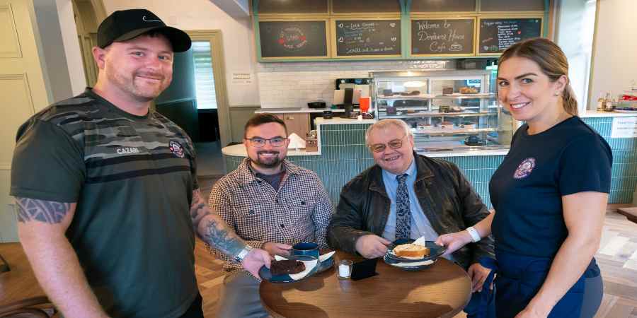 Councillor Danny Meredith and Councillor Neil Emmott with cafe staff.