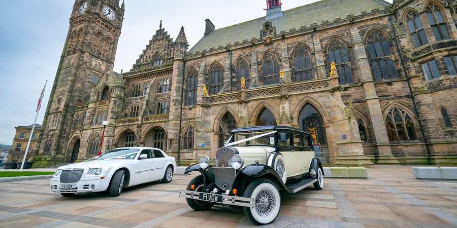 Wedding cars parked outside the town hall.