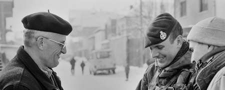 Soldier speaking with civilian.