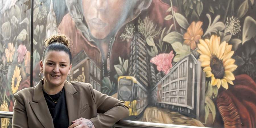 Hayley Garner in front of the mural.