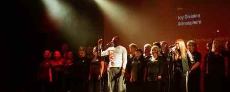 Micah Stalgic and choir Local Vocals.