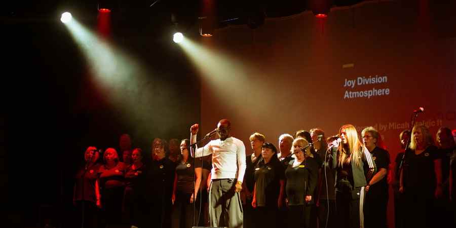 Micah Stalgic and choir Local Vocals.