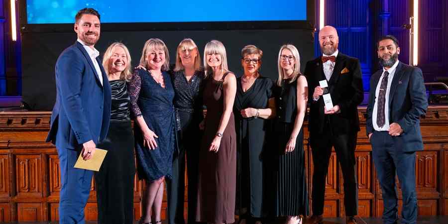 Luke O'Shaughnessy with the registration team and Julie Murphy.