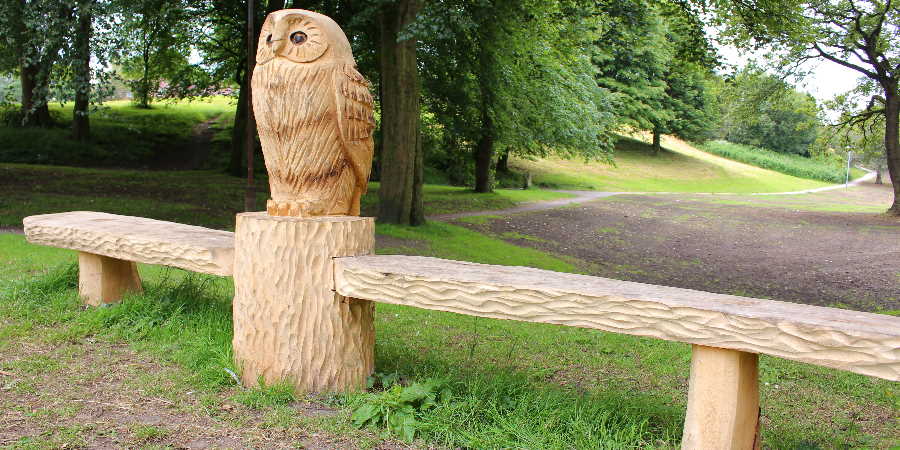 Carved owl bench at Balderstone Park.