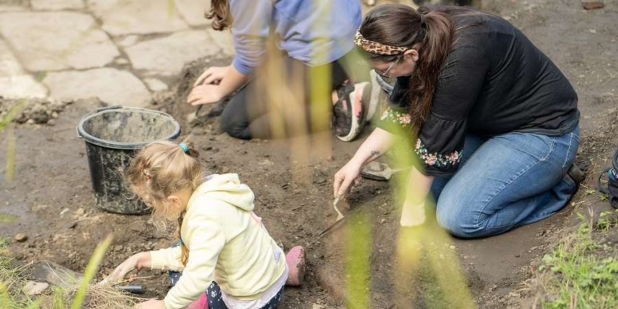 Families taking part in a big dig.