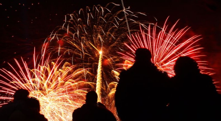 Crowds watching fireworks.