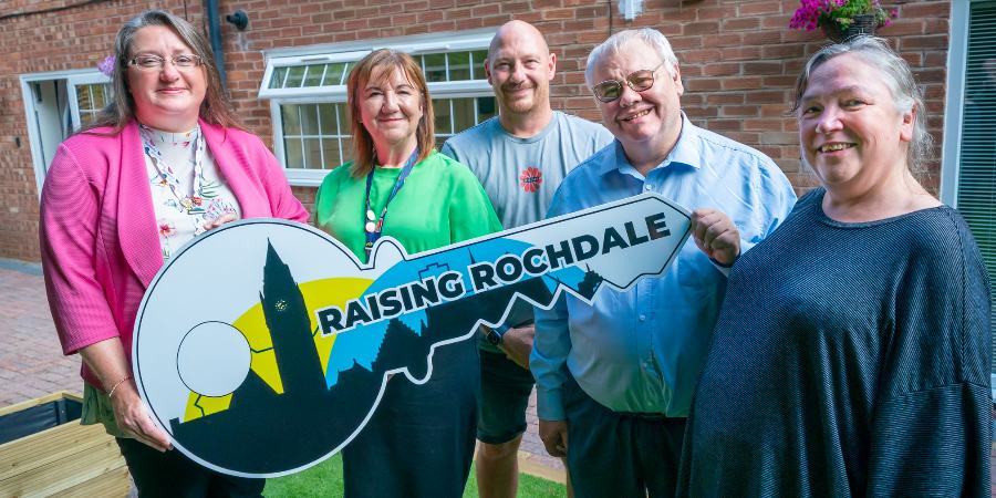 Councillors Rachel Massey and Neil Emmott with staff outside the home.