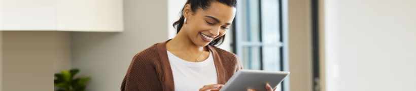 A woman using a tablet.