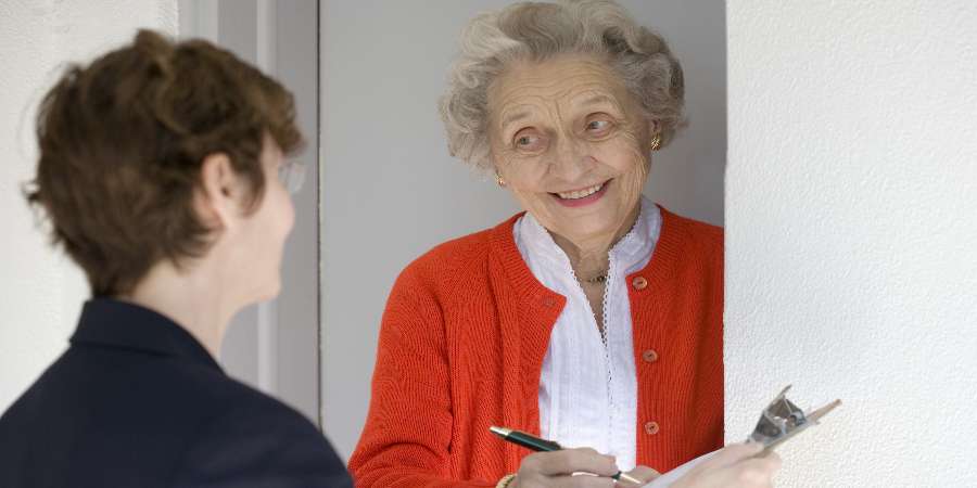 2 adults in conversation.