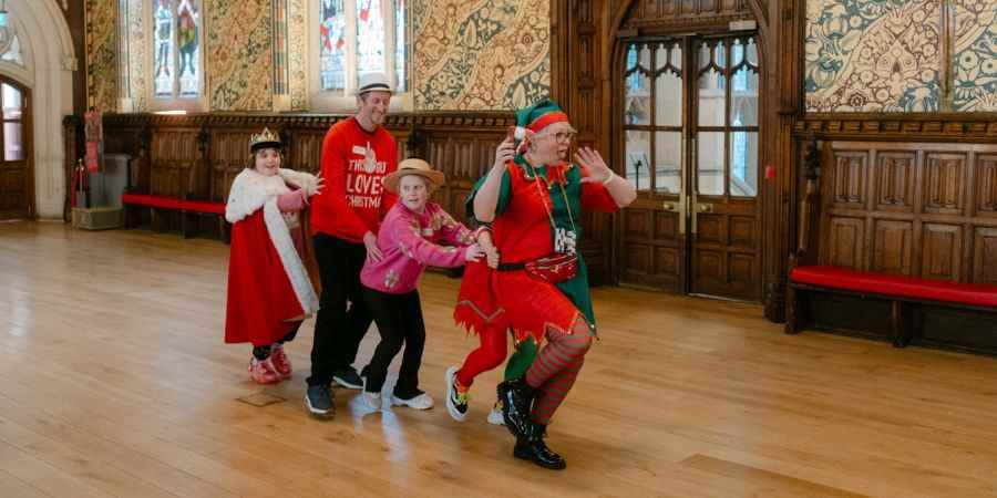 Children with volunteers dressed as elves.