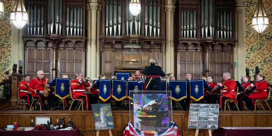 Military band playing in the town hall.