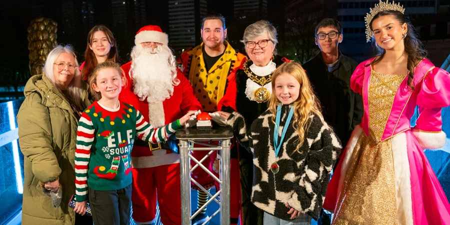 Councillor Sue Smith with Santa Claus, the mayor of Rochdale and guests.