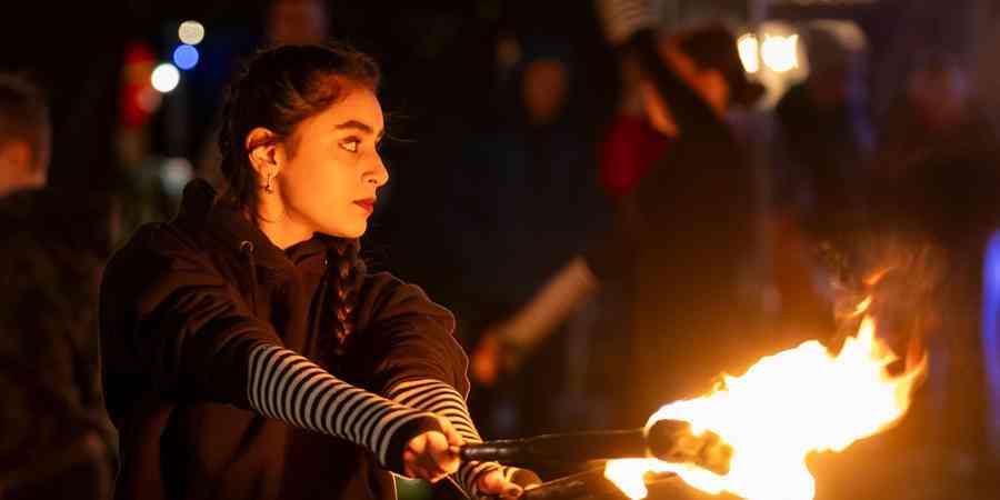 Circus performer using fire.