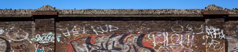 A wall covered in graffiti.