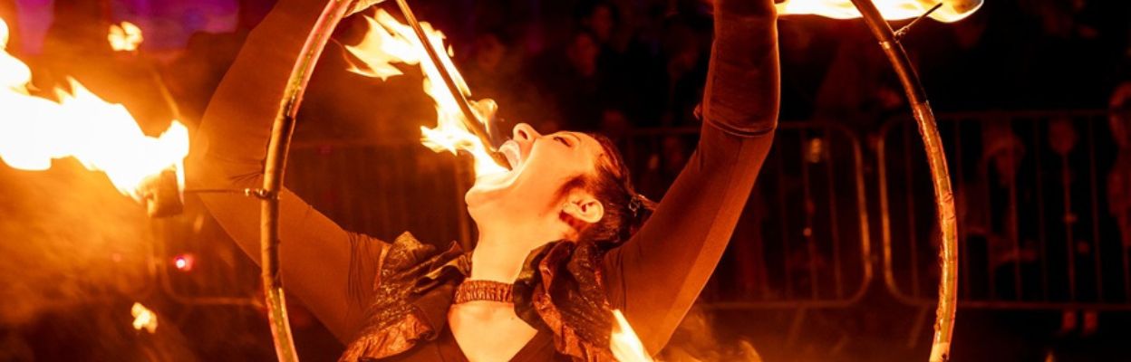 A person breathing fire.