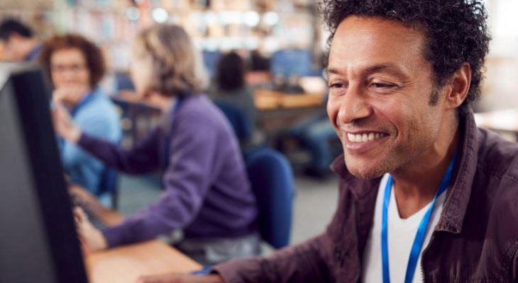 Adult learners in a computer class.