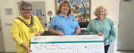 Councillor Janet Emsley, Jolly Josh manager Sarah Ford and Councillor Tricia Ayrton with a large cheque.