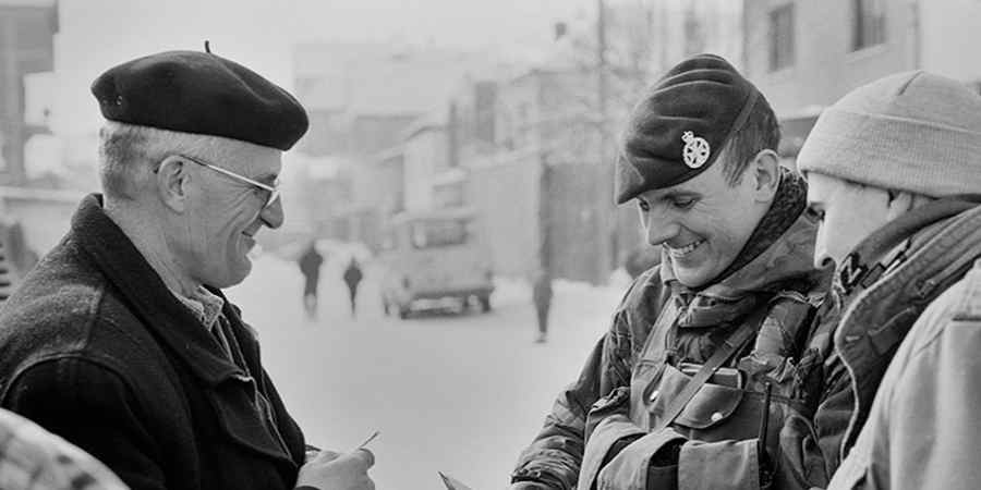 Soldier with a civilian in Kosova.