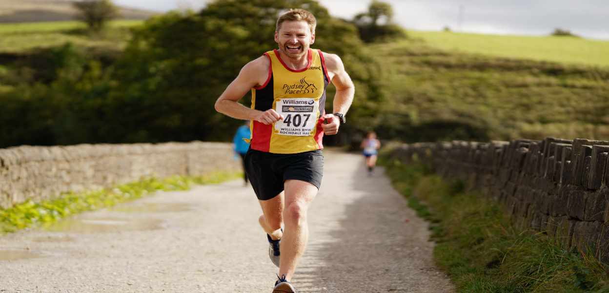 A runner passing Hollingworth Lake.