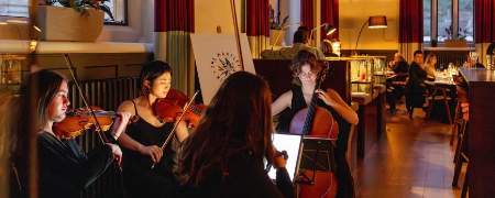 String quartet playing in the Martlet Kitchen.