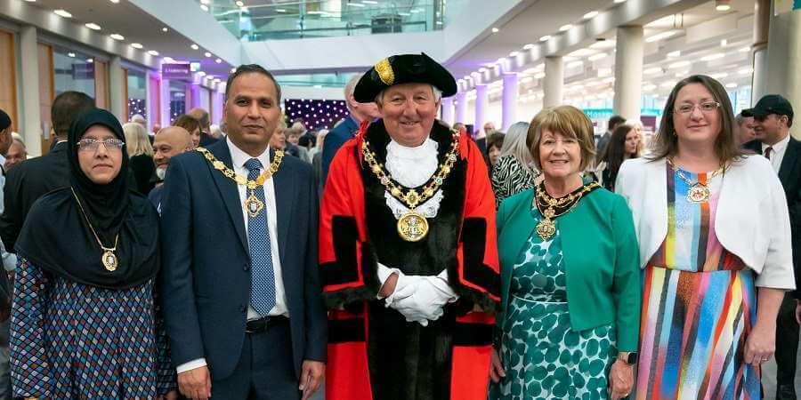 Mayor councillor Mike Holly, and mayoress Margaret Holly (centre) with deputy mayor councillor Shakil Ahmed, deputy mayoress Robina Bi and deputy consort councillor Rachel Massey after the ceremony at Number One Riverside.