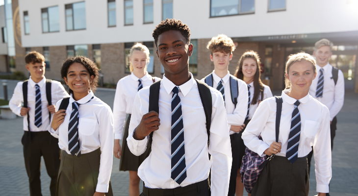 Secondary school children wearing uniforms.