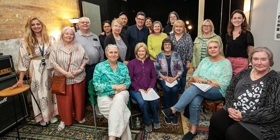 Andy Burnham, Councillor Neil Emmott, Councillor Sue Smith, Shilpa Gupta and a Ukrainian community choir.
