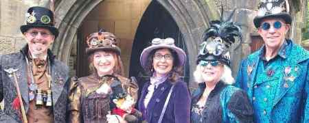 Visitors dressed in steampunk themed outfits.
