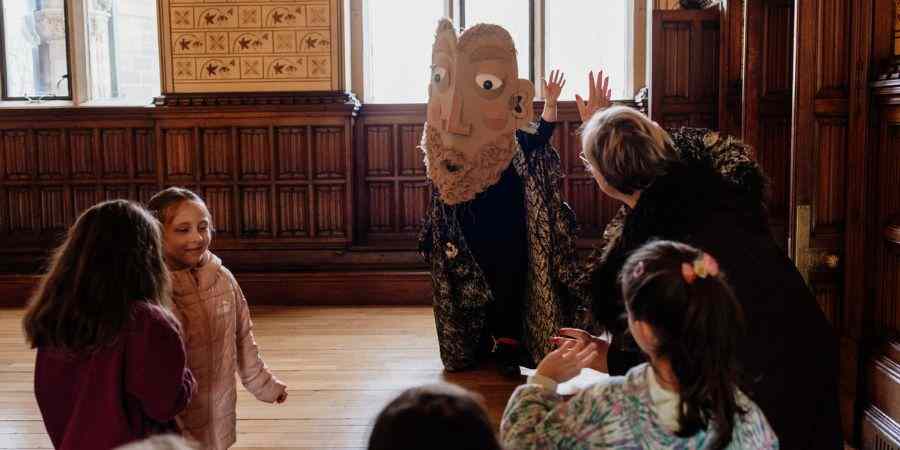Children listening to a story in the Town Hall.