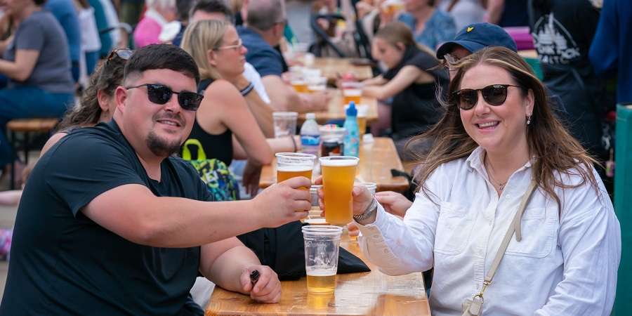Visitors with beers at Street Eat.
