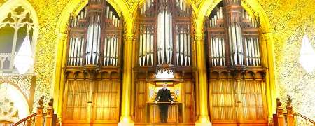 Jonathan Scott in front of the town hall organ.