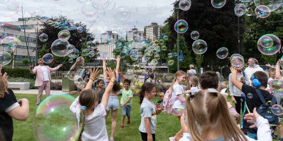 Children playing with bubbles.